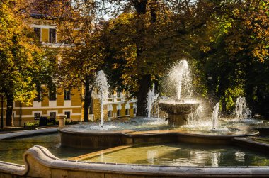 Pecs, Hungary - October 06, 2018: The fountain in the city park Pecs, Hungary, in the fall.