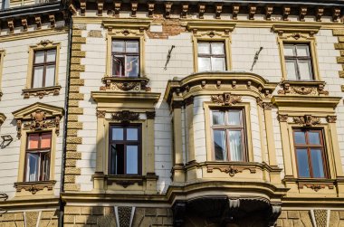 Pecs, Hungary - October 06, 2018: Windows with decorative baroque facades in the center of Pecs, Hungary