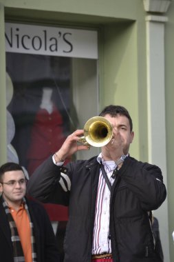 Novi Sad, Serbia - December 31, 2012: Trumpeters in the city before the new year. Trumpeters in the city before the New Year entertain their fellow citizens with their music.