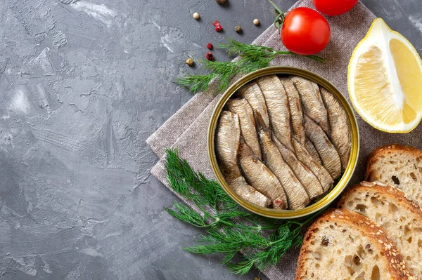 Smoked Sardines Open Tin Can Crispy Whole Grain Bread Greens — Stockfoto