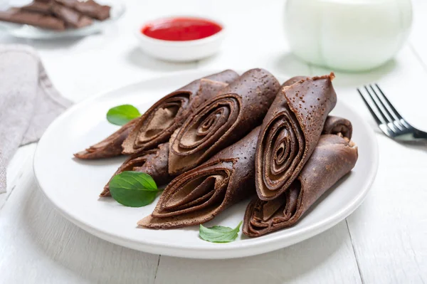 Thin Chocolate Pancakes Rolls Milk Jam White Wooden Background Tasty — Stock Photo, Image