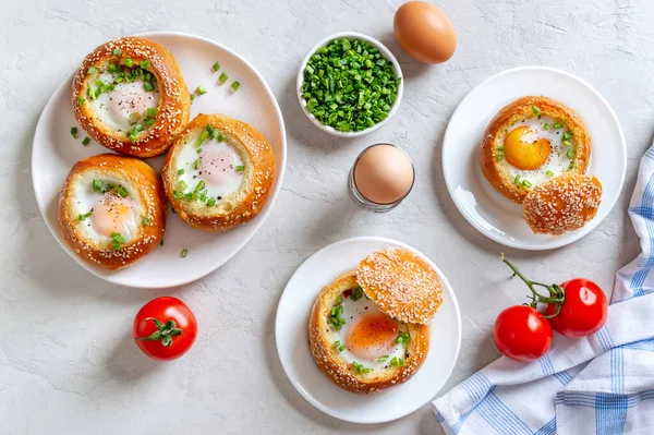 Baked Buns Stuffed Eggs Bacon Plates Light Background Carte Breakfast — стоковое фото