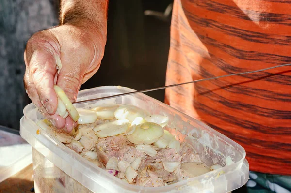Man Puts Marinated Meat Onions Skewer Close Barbecue Shish Kebab — Foto de Stock