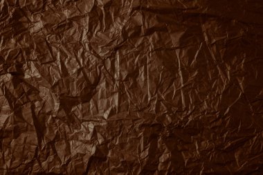 Buruşmuş sepia kağıt dokusu.