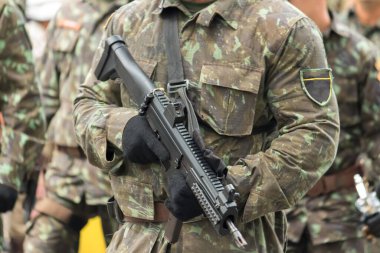 Army Soldier with machine gun in military parade.