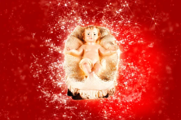 Figura Belén Bebé Jesús Con Fondo Rojo — Foto de Stock