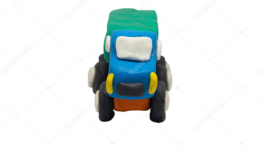 Plasticine in the shape of a Truck car. Front view of a child-like hand-crafted car. On isolated white background with clipping path.