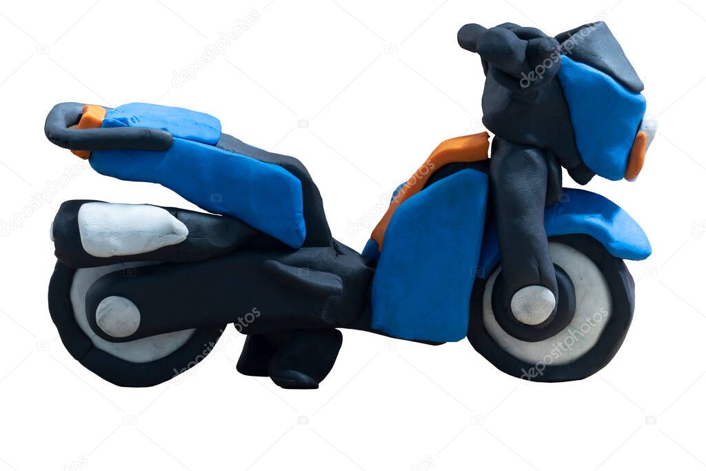 Plasticine in the shape beside of blue motorcycle. Isomatic view of a child-like hand-crafted bike. On isolated white background with clipping path.