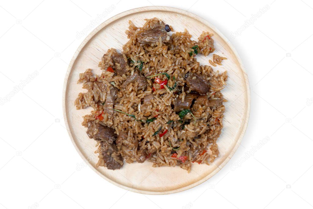 Above view of Braised Pork with Basil mixed with rice. on a flat wooden plate. with isolated white background.