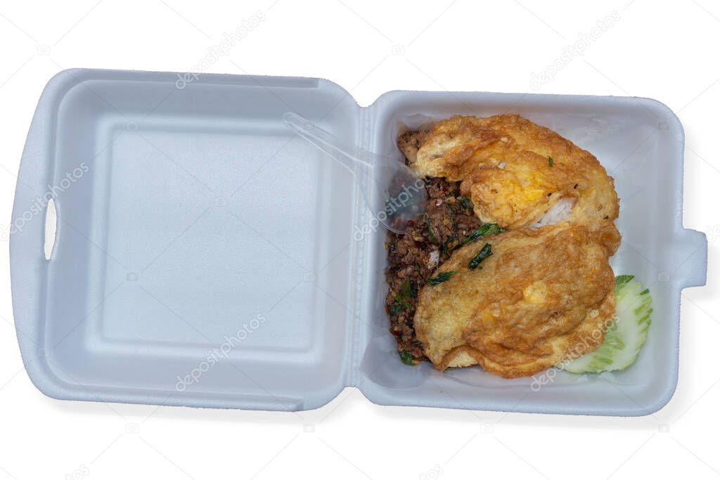 Minced Pork with Basil and omelet in foam box. Ready-to-eat plastic spoons. for a quick meal. on isolated white background with clipping path.