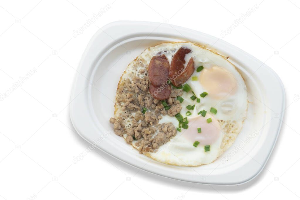 Indochina pan-fried egg with toppings in my homemade. Arrange on a white paper plate. On isolated white background with clipping path.