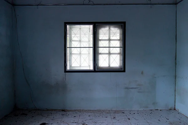 window inside the house with the environment of the house that is dirty and dark. abandoned buildings.