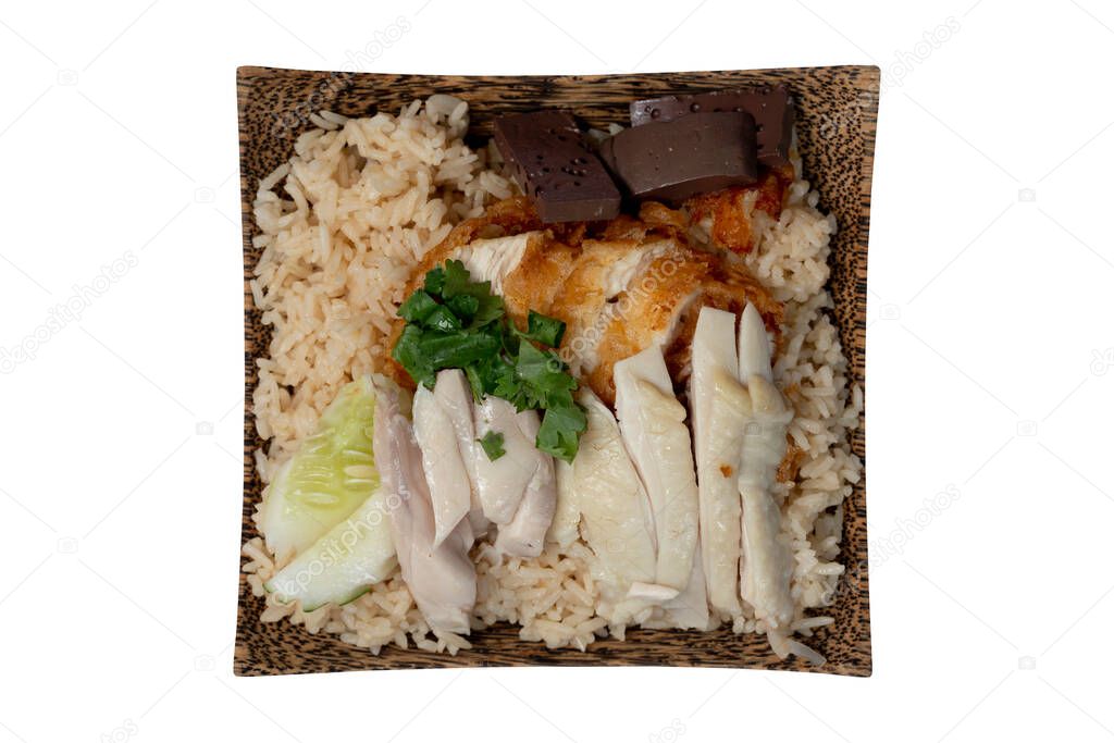 Above view of Hainanese chicken glutinous rice mix with Fried Chicken. Served in a coconut-patterned dish. Isolate white background with clipping path.
