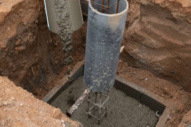 Stone cement mix that is poured onto the blocks. pillar base for building a house. In a pit dug one meter deep. for the basics of building a new home.