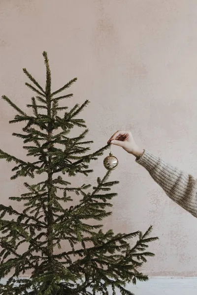 Female Hand Decorate Christmas Tree Golden Bauble Front Neutral Dusty — Stock Photo, Image