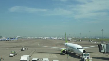 Tokyo,Japan - June 30, 2022:(Time-Lapse) Aircraft parking apron near second terminal at Tokyo Haneda International Airport
