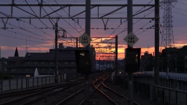 Tokyo,Japan - August 1, 2022: Keio Railway train arriving at Keio Tama Center Station at sunrise