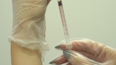 Facial injection procedure. Plastic surgery. Blockage of facial muscles. Wrinkle smoothing by injection. Facial rejuvenation procedure.