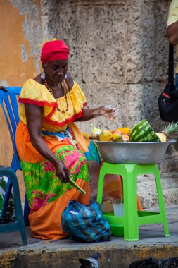CARTAGENA DE INDIAS, COLOMBIA - AUGUST, 2011: Traditional fruits street vendor in Cartagena de Indias called Palenquera
