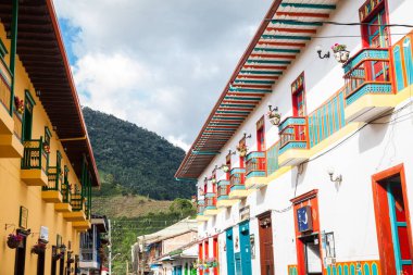 JARDIN, COLOMBIA - NOVEMBER, 2017: Beautiful houses next to the central square at the colonial town of Jardin in the Southwestern Antioquia in Colombia