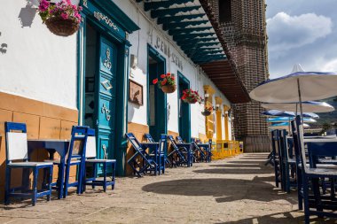 JARDIN, COLOMBIA - NOVEMBER, 2017: Beautiful houses next to the central square at the colonial town of Jardin in the Southwestern Antioquia in Colombia