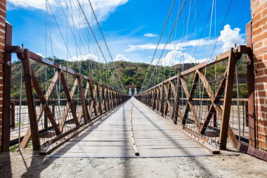 The historical Bridge of the West a a suspension bridge declared Colombian National Monument built in 1887 over the Cauca River