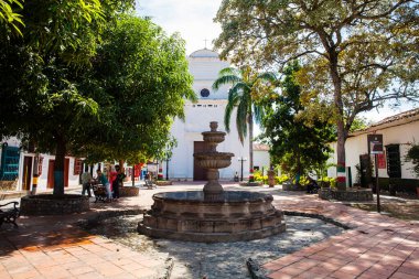 SANTA FE DE ANTIOQUIA, , COLOMBIA - NOVEMBER, 2017: Jesus Nazareno church and square at the beautiful colonial town of Santa Fe de Antioquia in Colombia