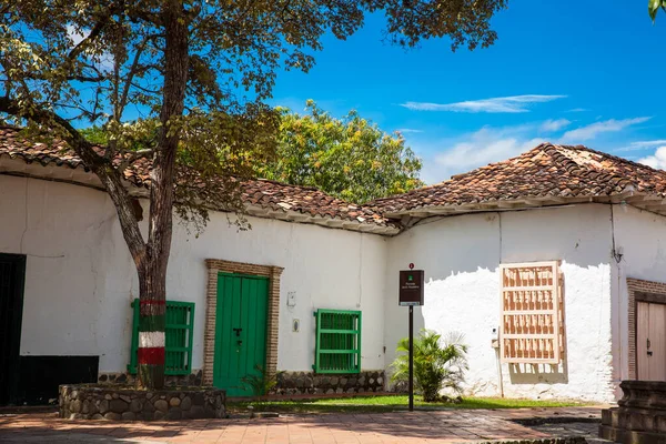 SANTA FE DE ANTIOQUIA, , COLOMBIA - NOVEMBER, 2017: Antique houses around the Jesus Nazareno square at the beautiful colonial town of Santa Fe de Antioquia in Colombia
