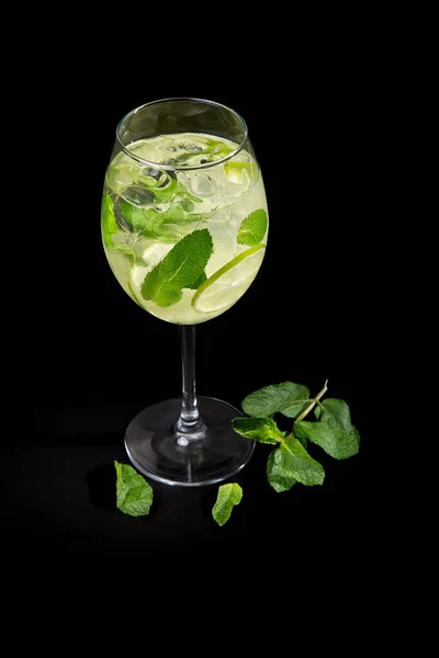 Aperitif is a refreshing cocktail of lemonade made from citrus slices. Soft drink with syrup and soda and ice cubes.