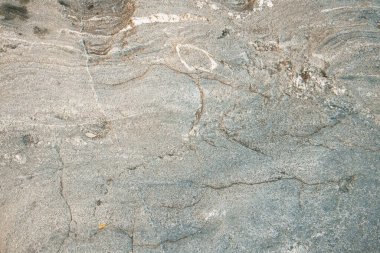 Çatlak ve dokuları olan doğal taşın alışılmadık dokusu. Doğal granit bir mineral taşıdır. Kavram - arkaplan için doku