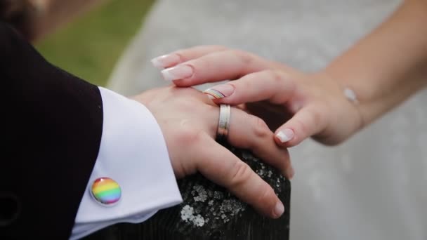 Lgbt Wedding Close Newlyweds Hands Pride Rainbow Emblem Elements Nail — Stok Video