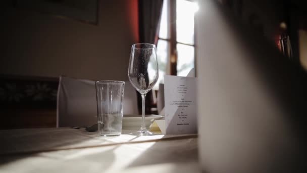 Laconic Minimalist Table Setting Empty Glasses White Plates Tablecloth Dining — Videoclip de stoc