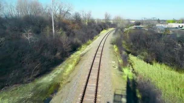 View through the train window on the railway track. Railway Flights. Narrow gauge road. — Vídeos de Stock