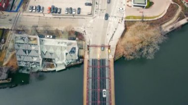 Aerial Top view of traffic moving through the streets of Chicago. Urban transit that crosses the Chicago River Bridge in the center of the city