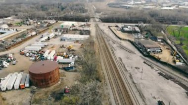 The railway track approaching the industrial center of production and warehouses for the storage of industrial products. Industrial center