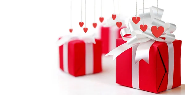 Valentines Day pozadí, blahopřání s červenými dárkovými krabicemi — Stock fotografie