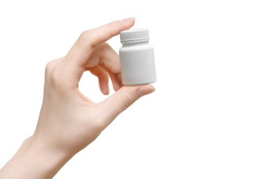 Kadınların elinde beyaz plastik bir ilaç şişesi..