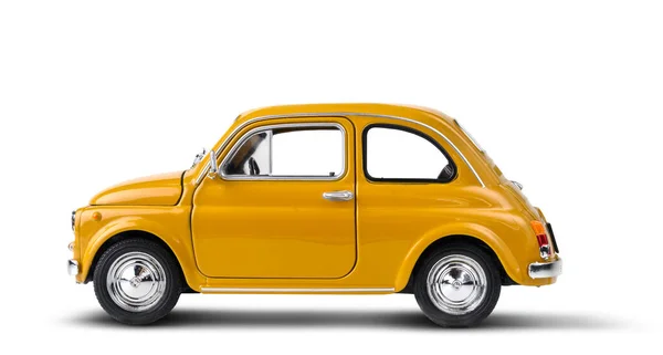 Coche de juguete retro amarillo aislado en blanco — Foto de Stock