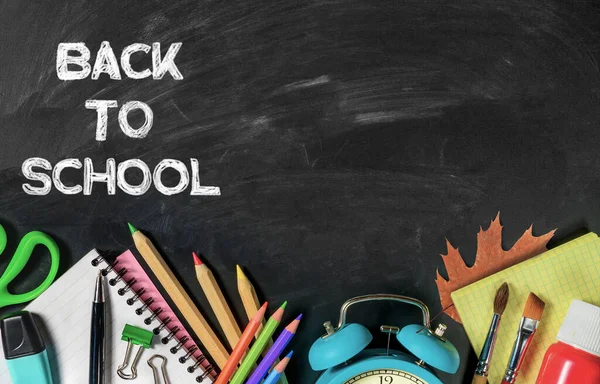 Back to school banner, background with School supplies and lettering on chalkboard. Copy space