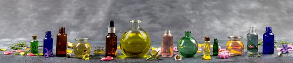 Panoramic of essential oils aligned macerates — Stock Photo, Image