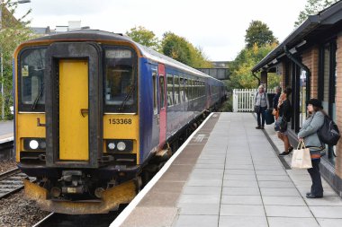 Trowbridge, UK - October 18, 2015: A train arrives at the town station. Opened in 1848 the station operates on the Wessex Main Line with an annual ridership of 850,000.