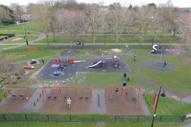 Children play in a playground in a town park on March 21, 2016 in Trowbridge, UK