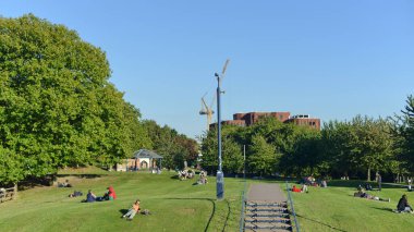 Bristol, UK - October 5, 2016: People gather in Castle Park in the city centre. Castle Park also known as Castle Green is a public open space managed by the city council.