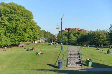 Bristol, UK - October 5, 2016: People gather in Castle Park in the city centre. Castle Park also known as Castle Green is a public open space managed by the city council.
