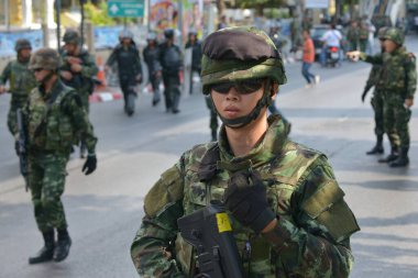 An armed Thai soldiers guard on a street during an anti coup rally on May 25, 2014 in Bangkok, Thailand. Thailand has seen 20 coup d'etat and attempted coups since 1912.