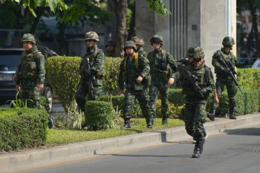 An armed Thai soldiers guard on a street during an anti coup rally on May 25, 2014 in Bangkok, Thailand. Thailand has seen 20 coup d'etat and attempted coups since 1912.