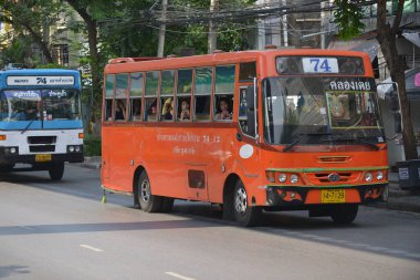 A bus drives along a city centre road on May 25, 2014 in Bangkok, Thailand. Buses are a popular and inexpensive mode of transport in the Thai capital.