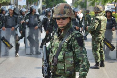 An armed Thai soldiers guard on a street during an anti coup rally on May 25, 2014 in Bangkok, Thailand. Thailand has seen 20 coup d'etat and attempted coups since 1912.