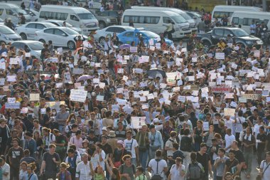 Anti coup protesters march on a city centre street on May 25, 2014 in Bangkok, Thailand. The southeast asian nation has seen 20 coup d'etat and attempted coups since 1912.