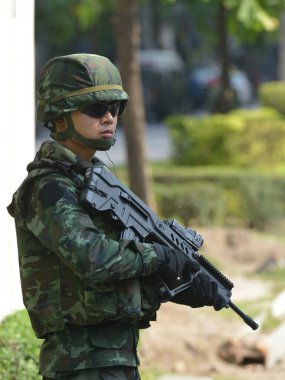 An armed Thai soldiers guard on a street during an anti coup rally on May 25, 2014 in Bangkok, Thailand. Thailand has seen 20 coup d'etat and attempted coups since 1912.